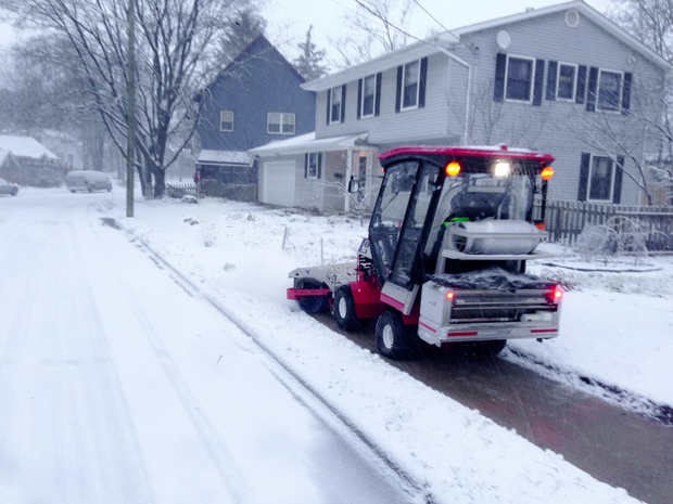 The SnowBuddy tractor, driven and funded by volunteers, clears all 12 miles of sidewalk of the Water Hill neighborhood of Ann Arbor, Michigan. (Paul Tinkerhess)